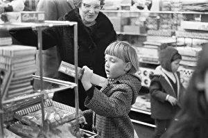Department Store Prints: A little girl checks out the latest Sindy doll in the toy department of Heelas Department