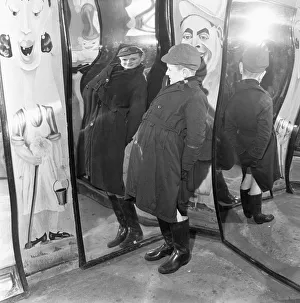 Little Peter MacNeil (10) has a laugh at himself in the distorted mirrors at the Louis
