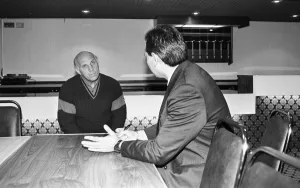 Liverpool caretaker manager Ronnie Moran gives the team news to Echo sports writer Nic