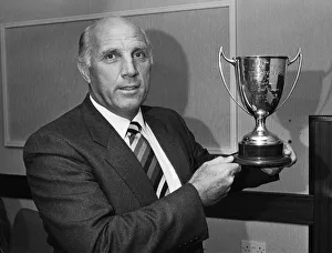 Award Ceremonies Prints: Liverpool coach Ronnie Moran holds the Dixie Dean Memorial trophy after nearly forty