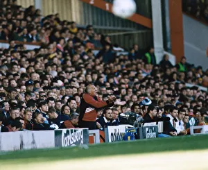 Management Prints: Liverpool coach Ronnie Moran shouting out instructions from the dugout during a Premier