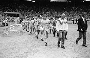 Liverpool coach Ronnie Moran walks out on to the pitch at Wembley as he leads his side