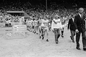 Liverpool coach Ronnie Moran walks out on to the pitch at Wembley as he leads his side