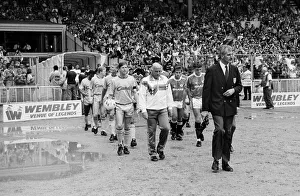 Liverpool coach Ronnie Moran walks out on to the pitch at Wembley as he leads his side