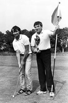 Kirkby Prints: Liverpool comedian Jimmy Tarbuck is pictured presenting the trophy to John Kelley after