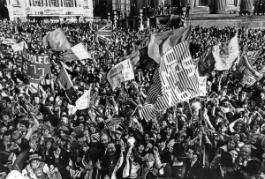 01127 Prints: Liverpool FC fans wait to cheer their team in the city centre to celebrate their historic
