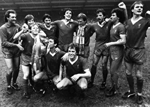 Liverpool FC players celebrate after winning the League for a record 13th time