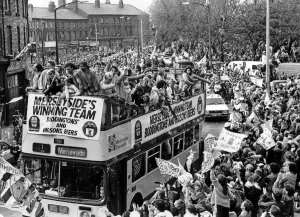 Flags Prints: The Liverpool FC Victory Bus passes through Liverpool City Centre as the players enjoy a