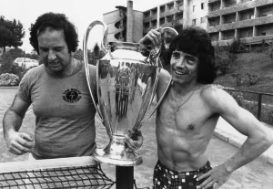 Liverpool football star Kevin Keegan poses with the European Cup trophy at the team hotel