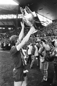 Liverpool Football team celebrate winning the League title after defeating Aston Villa