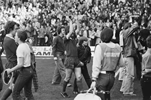 Liverpool Football team celebrate winning the League title after defeating Aston Villa