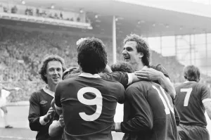 Liverpool Football team celebrate winning the League title after defeating Aston Villa