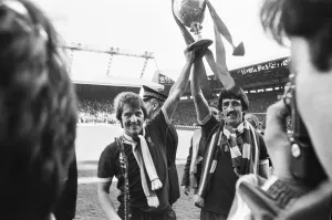 Liverpool Football team celebrate winning the League title after defeating Aston Villa