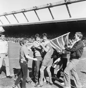 Liverpool Football team celebrate winning the League title after defeating Aston Villa