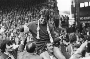 Liverpool Football team celebrate winning the League title after defeating Aston Villa