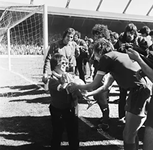 Liverpool Football team celebrate winning the League title after defeating Aston Villa