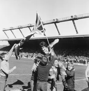 Liverpool Football team celebrate winning the League title after defeating Aston Villa