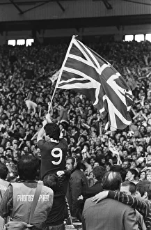 Liverpool Football team celebrate winning the League title after defeating Aston Villa