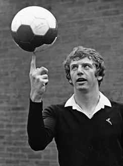 Ball Prints: Liverpool footballer David Fairclough balances a football on his finger as he poses