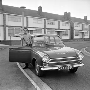 Driving Prints: Liverpool footballer Ian St. John with his new Ford Cortina in Liverpool