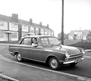 Liverpool footballer Ian St. John with his new Ford Cortina in Liverpool