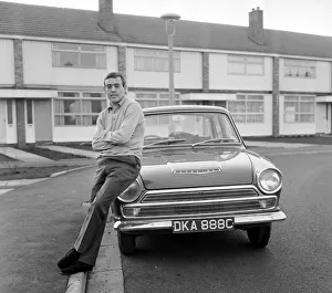 Liverpool footballer Ian St. John with his new Ford Cortina in Liverpool