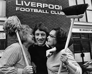 Brush Prints: Liverpool footballer Jimmy Case gets an extra special welcome from two workers at Anfield