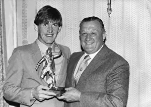 Liverpool footballer Kenny Dalglish recieves an award from manager Bob Paisley