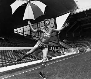 Umbrella Prints: Liverpool footballer Phil Neal models the new Liverpool kit at Anfield