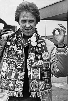 01130 Prints: Liverpool footballer Phil Neal wearing a club scarf decorated with badges celebrating