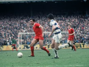 Liverpool footballer Ray Kennedy running with the ball during the League Division One