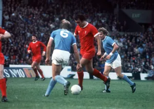 Liverpool footballer Ray Kennedy running with the ball during the League Division One