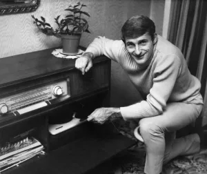 Equipment Prints: Liverpool footballer Roger Hunt listening to music at home. Circa 1966
