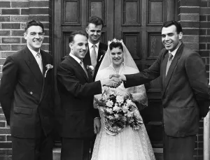 Groom Prints: Liverpool footballer Ronnie Moran and his wife Joyce surrounded by friends on their
