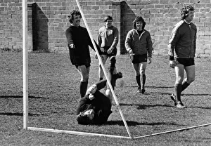 Accidents Prints: Liverpool footballer Tommy Smith down on the ground after taking a tumble during a light