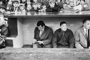 Trainer Prints: Liverpool footballer Tony Hateley in the dugout with trainer Bob Paisley as he sits out