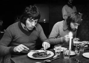 Dinner Prints: Liverpool footballers Kevin Keegan and Steve Heighway eating their lunch by candlelight