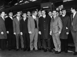 Suit Prints: Liverpool footballers pose together at Lime Street Railway station before making he