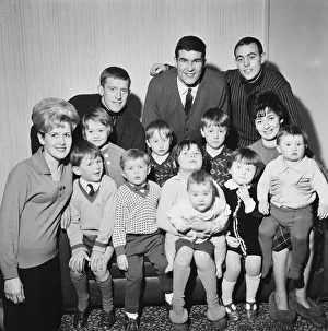 Liverpool footballers Ron Yeats and Ian St John pose with their children