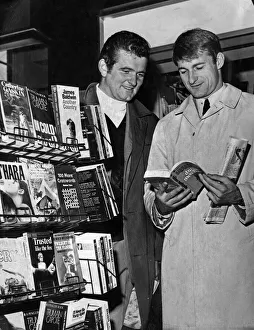 Magazine Prints: Liverpool footballers Tommy Lawrence and Roger Hunt looking through books at a stall in