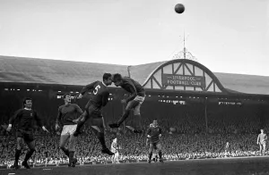 Core61 Prints: Liverpool forward Ron Yeats and Manchester Uniteds John Fitzpatrick in ahigh ball