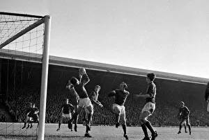 Liverpool forward Ron Yeats surrounded by manchester United players as Alex Stepney drops