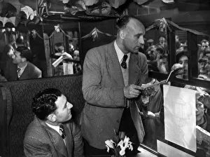 Liverpool goalkeeper Cyril Sidlow (seated) and right back Ray Lambert answer the urgent