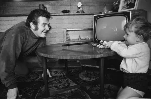 Liverpool goalkeeper Tommy Lawrence playing with his young son Stephen aged two