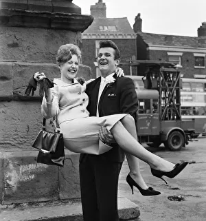 Liverpool goalkeeper Tommy Lawrence poses with his 19 year old bride Judith price after