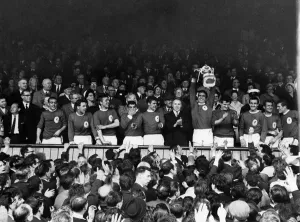 00251 Prints: Liverpool League champs: The Liverpool team wave to the crowds from the directors box