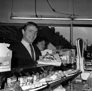 Groceries Prints: Liverpool left winger Peter Thompson buys the Bacon at the local shop for his
