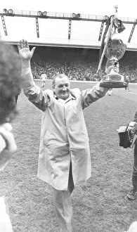 Liverpool Manager Bob Paisley holding up the League Championship trophy to the Anfield