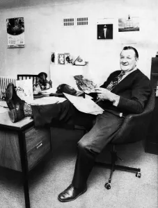 00565 Prints: Liverpool manager Bob Paisley looking relaxed with his leg on the desk as he reads