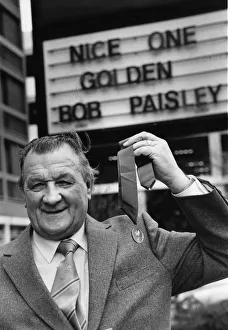 Liverpool manager Bob Paisley proudly displays his latest award as